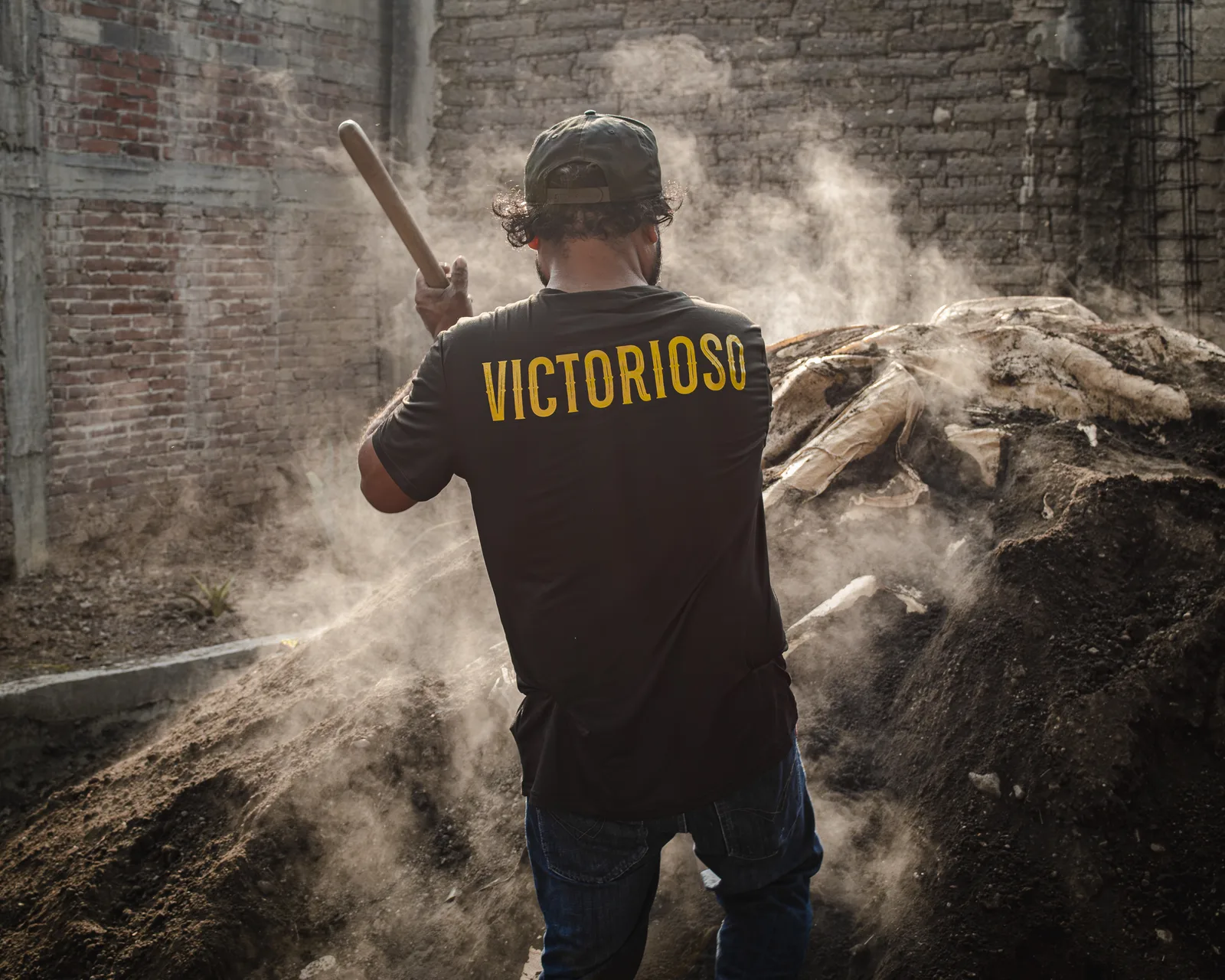 Mezcal maestro at the agave roasting pit